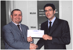 Khaled Ramadan accepts his prize from Rabea Ataya, CEO of Bayt.com